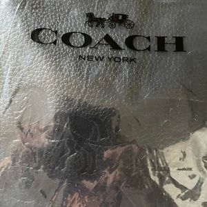 Coach black leather cross body purse with strap. New in bag.